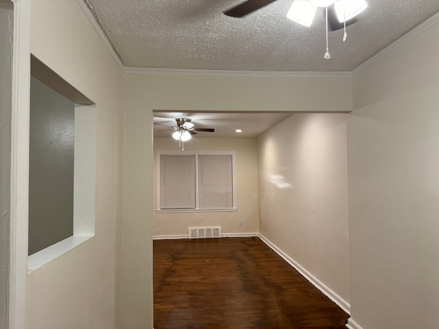 interior space with crown molding, dark hardwood / wood-style flooring, and a textured ceiling