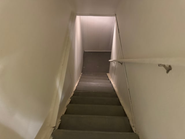 stairway with wood-type flooring