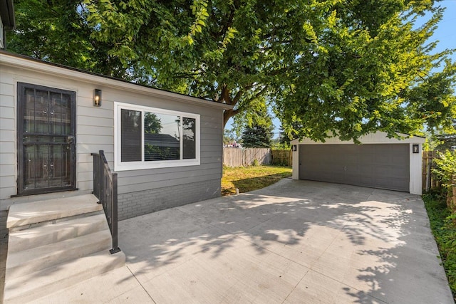 view of patio with a garage and an outdoor structure