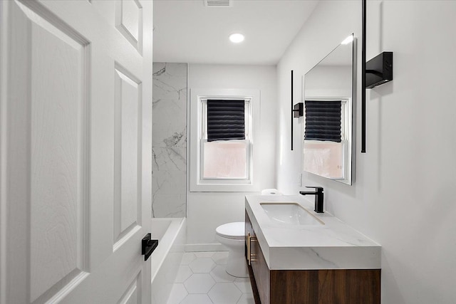 full bathroom featuring tile patterned floors, vanity, toilet, and shower / bathtub combination