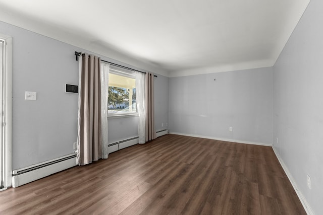 unfurnished room with a baseboard radiator and dark wood-type flooring