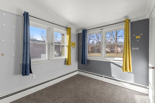 carpeted empty room featuring vaulted ceiling and a baseboard heating unit