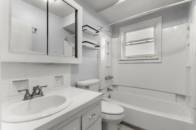 full bathroom with decorative backsplash, vanity, shower / bath combination, and toilet