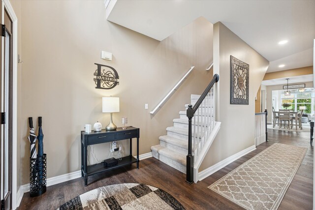 stairs with wood-type flooring