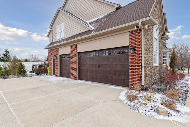 view of property exterior with a garage