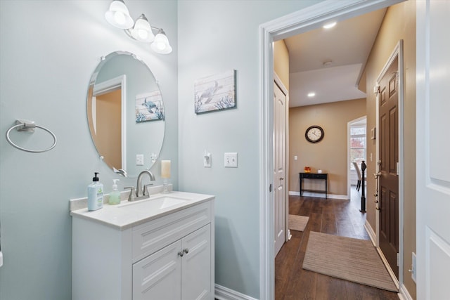 bathroom with vanity and wood-type flooring