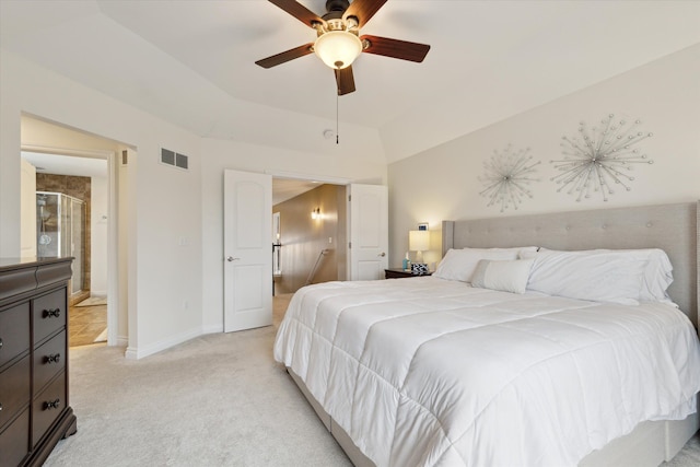 bedroom with ceiling fan, light colored carpet, and vaulted ceiling