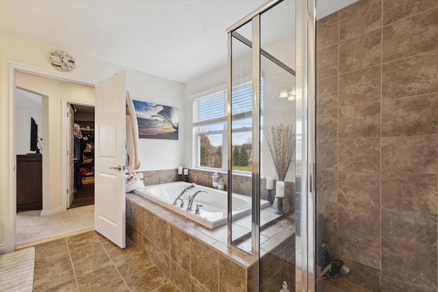 bathroom with tile patterned flooring and plus walk in shower