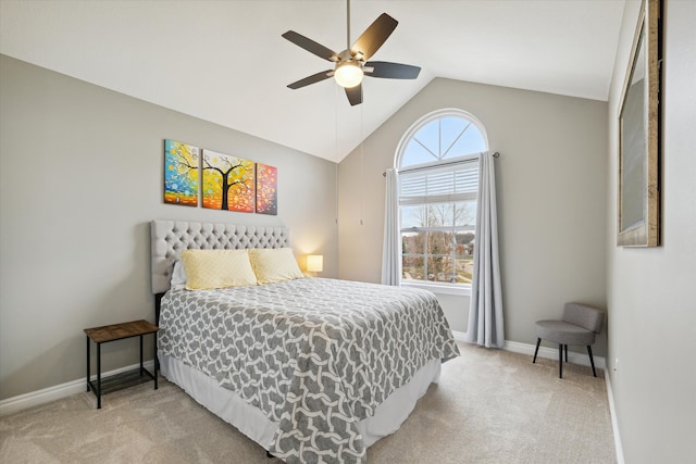 bedroom featuring ceiling fan, light colored carpet, and vaulted ceiling