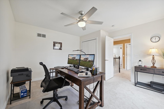 office featuring light carpet and ceiling fan