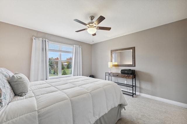 bedroom featuring light colored carpet and ceiling fan