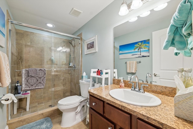 bathroom with tile patterned flooring, toilet, an enclosed shower, and vanity