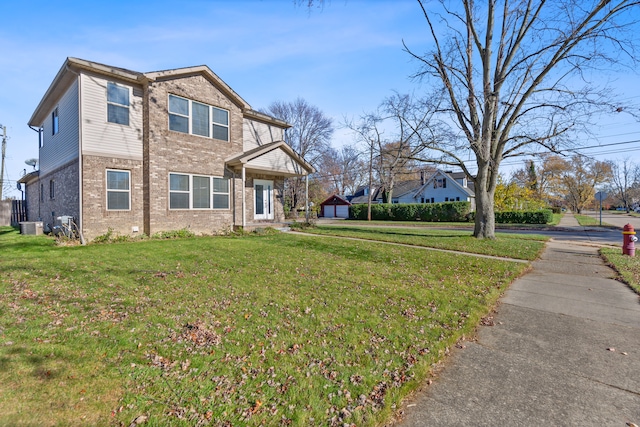 view of front of property featuring cooling unit and a front lawn