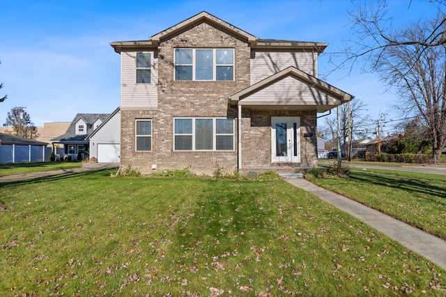 view of front of home featuring a garage and a front yard