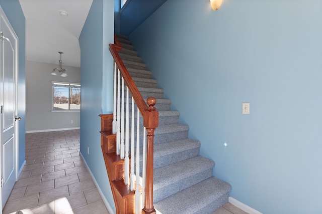 stairs featuring tile patterned floors