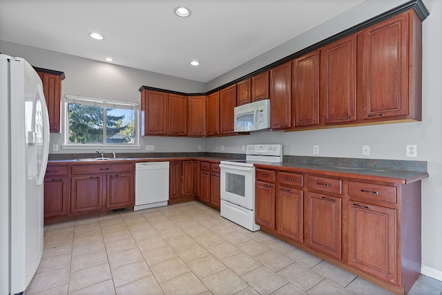 kitchen featuring sink and white appliances