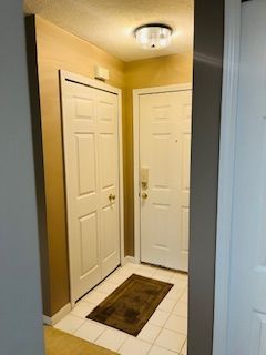 doorway featuring light tile patterned floors