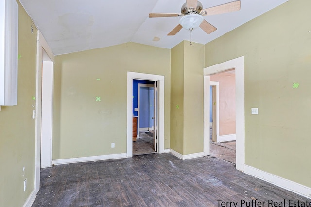 unfurnished room featuring dark wood-type flooring, lofted ceiling, and ceiling fan