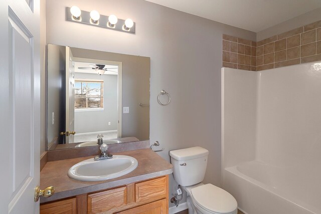 full bathroom with shower / bath combination, vanity, and toilet