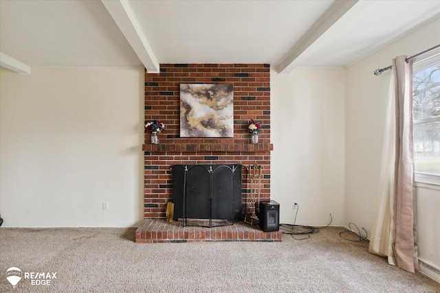 unfurnished living room featuring carpet floors, beamed ceiling, and a brick fireplace