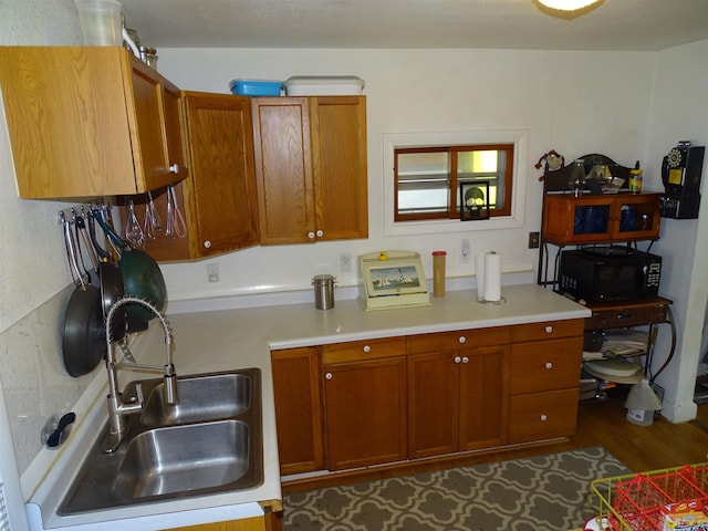 kitchen featuring hardwood / wood-style flooring and sink