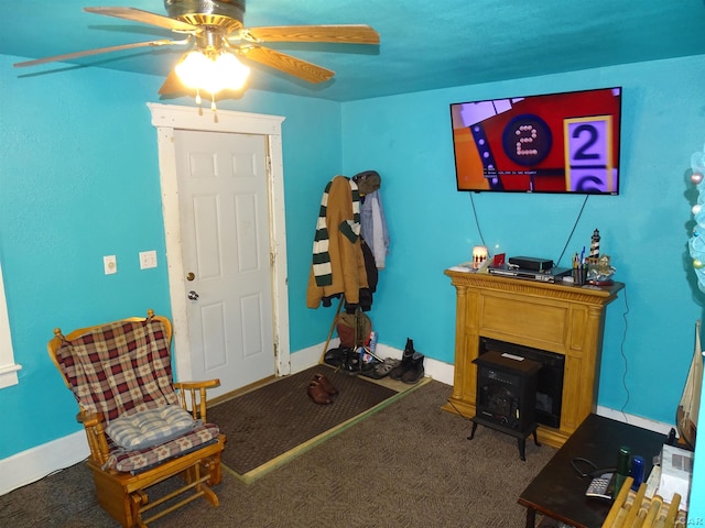 interior space featuring carpet flooring and ceiling fan