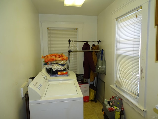 laundry room featuring washing machine and clothes dryer