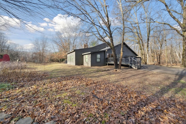 view of side of property with a deck