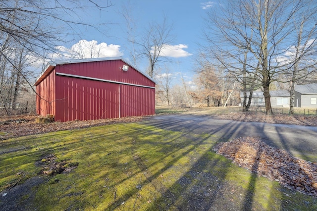 view of outbuilding with a lawn