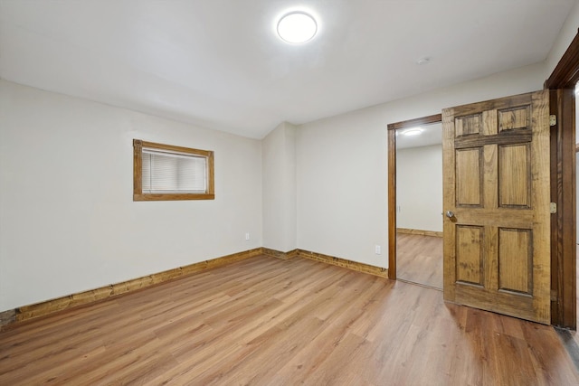 spare room featuring light wood-type flooring