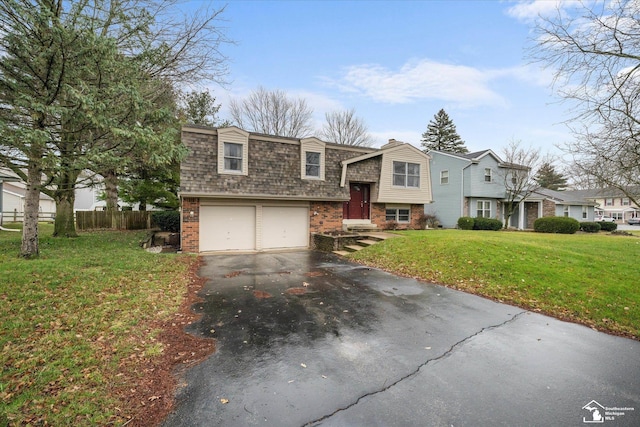 view of front facade featuring a front yard and a garage