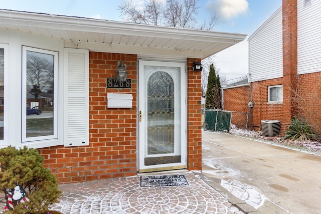 doorway to property with central AC