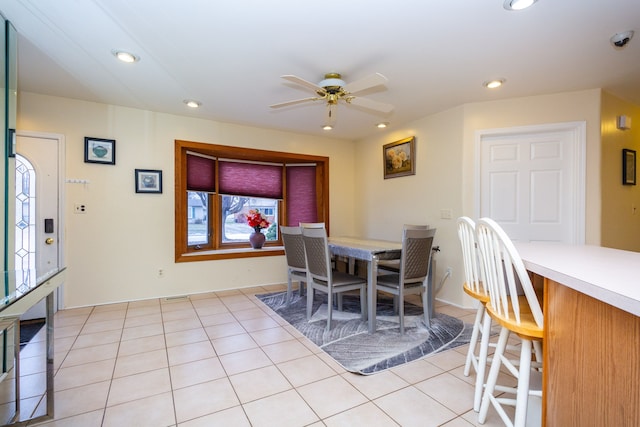 tiled dining room with ceiling fan