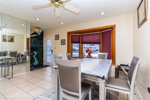 8268 Doncaster Dr, Sterling Heights, MI 48312 - dining area with light tile patterned flooring, a ceiling fan, and recessed lighting