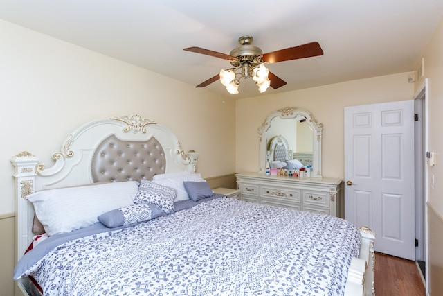 bedroom featuring hardwood / wood-style flooring and ceiling fan