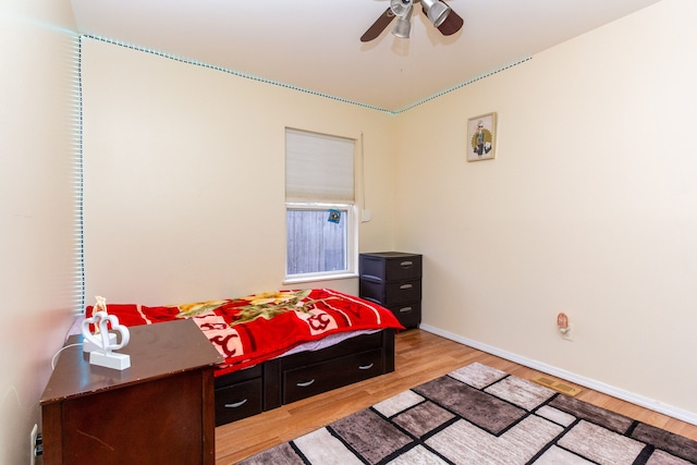 bedroom with ceiling fan and light wood-type flooring