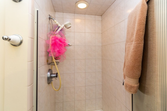 bathroom with a tile shower