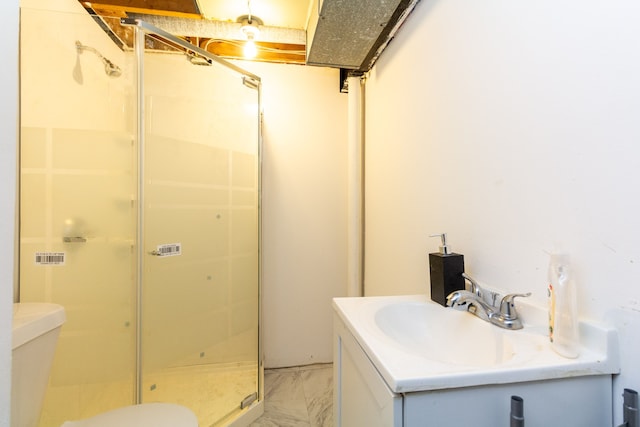 bathroom featuring vanity, toilet, and walk in shower