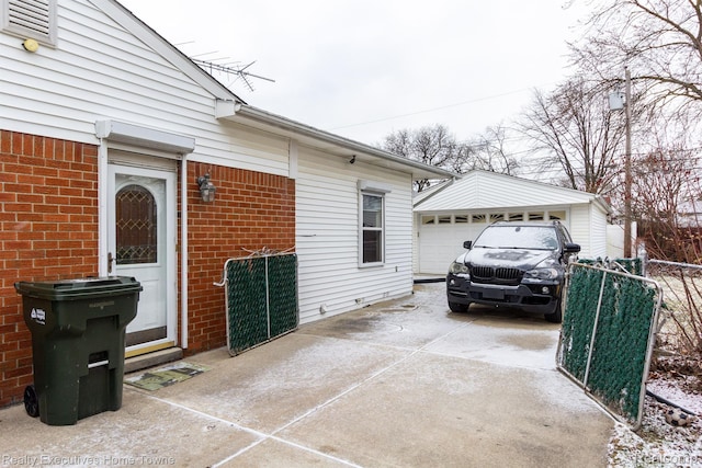 8268 Doncaster Dr, Sterling Heights, MI 48312 - view of home's exterior featuring brick siding, a garage, concrete driveway, and an outdoor structure