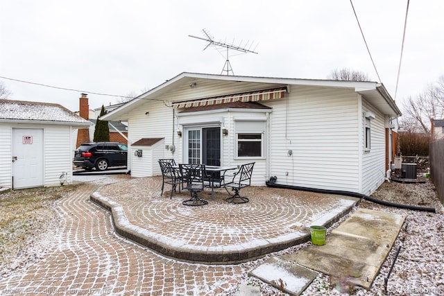 8268 Doncaster Dr, Sterling Heights, MI 48312 - back of property with a patio area