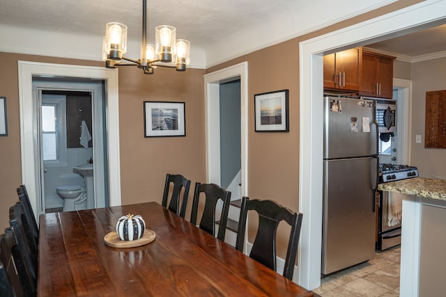 dining space featuring a notable chandelier, light tile patterned flooring, and ornamental molding