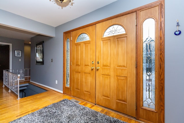 entryway with wood-type flooring