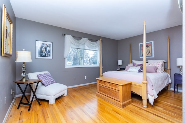 bedroom with hardwood / wood-style floors