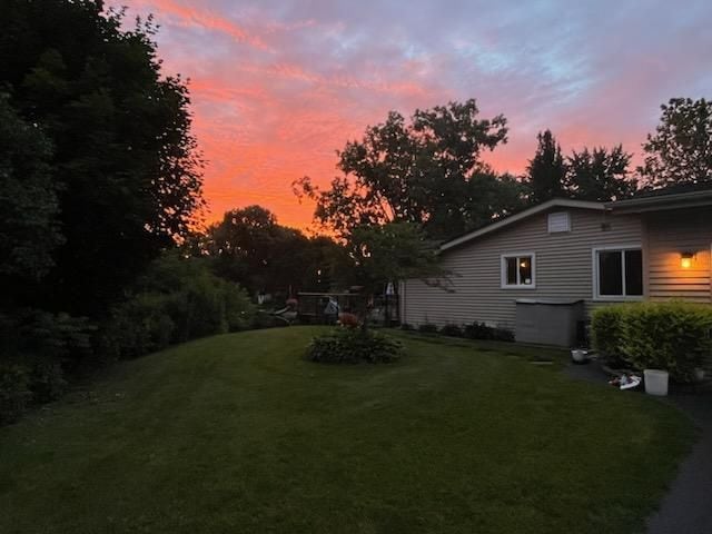 view of yard at dusk