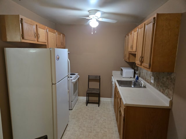 kitchen with backsplash, ceiling fan, white appliances, and sink