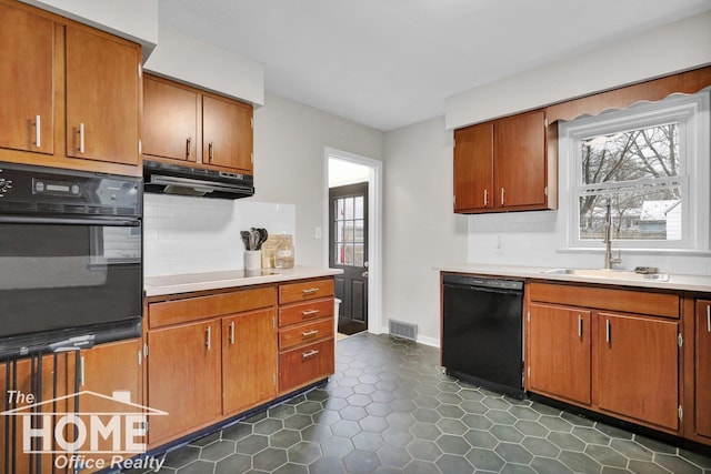 kitchen with black appliances, decorative backsplash, plenty of natural light, and sink