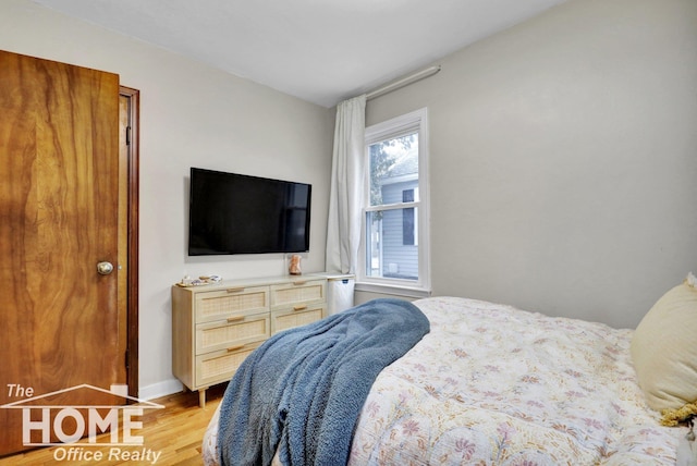 bedroom with light hardwood / wood-style flooring