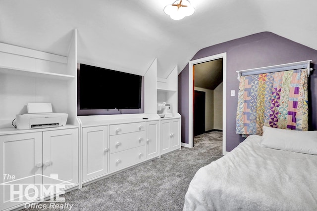 carpeted bedroom with vaulted ceiling