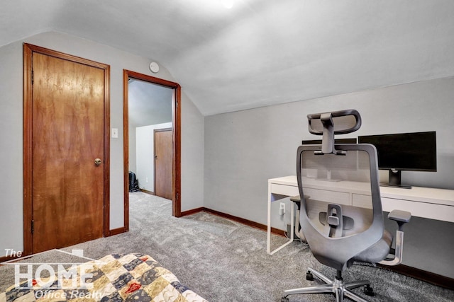 office area featuring light colored carpet and vaulted ceiling