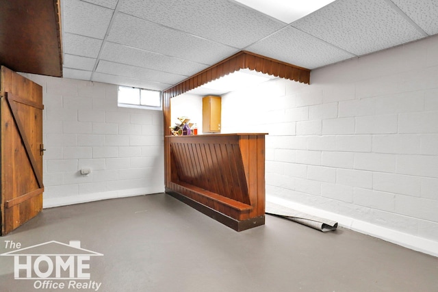 interior space featuring a paneled ceiling